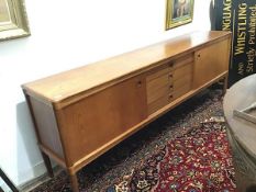 Bramin Mobler, a Danish teak sideboard, the long rectangular top above a central bank of four