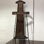 An Arts & Crafts copper and wrought-iron stick stand, c. 1900, the tapering hammered copper rear