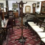 A late 19th century oak coat, hat and stick stand, the central baluster-turned standard issuing