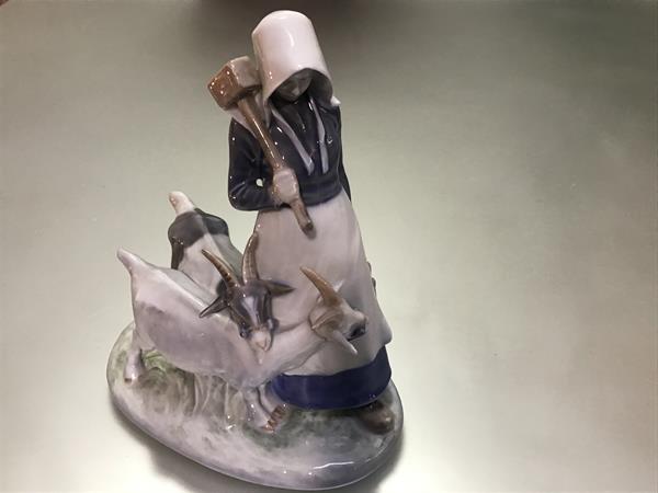 A Royal Copenhagen porcelain group, the goatherd, no. 694, painted and printed marks. 23cm