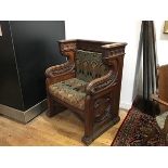 A 19th century Gothic Revival carved oak ecclesiastical throne chair, carved to the crest rail