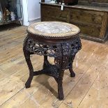 A Chinese marble-inset hardwood vase or jardiniere stand, c. 1900, the circular top with beaded