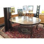 A large Whytock & Reid, Edinburgh mahogany wind-out dining table, early 20th century, the top with