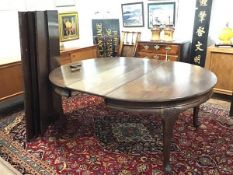 A large Whytock & Reid, Edinburgh mahogany wind-out dining table, early 20th century, the top with