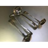 A group of four 19th century Scottish silver sauce ladles comprising: a pair, Alexander Coghill,