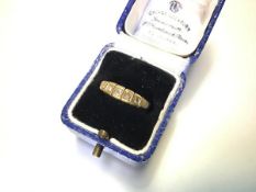 A late Victorian five-stone diamond ring, the graduated round brilliants each in a box setting on