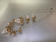 A 9ct gold and seed pearl necklace with brooch en suite, the necklace of five graduated elements