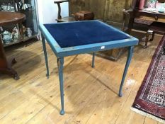 A blue-painted folding card table, c. 1920-30, the square velvet-inset top within a frame painted