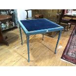 A blue-painted folding card table, c. 1920-30, the square velvet-inset top within a frame painted