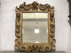 A giltwood mirror, the frame composed of 18th century and later period elements, the rectangular
