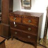 A small George III ebonised string inlaid mahogany chest of drawers, the rectangular crossbanded top
