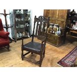 An oak elm open armchair in late 17th/early 18th century style, composed of some period elements,