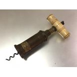 A 19th century bronze corkscrew, of Thomason type, with turned bone handle (lacking brush), the