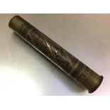A World War I trench art artillery shell casing overlaid in copper with Islamic decoration and