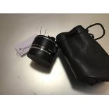 A Leica Extender-R 2x (lens extender), in a carry bag