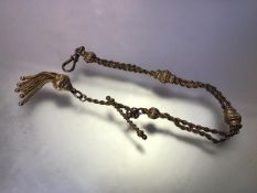 A late Victorian 9ct gold fancy link Albert watch chain, of double ropetwist strands with chased