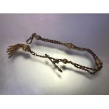 A late Victorian 9ct gold fancy link Albert watch chain, of double ropetwist strands with chased