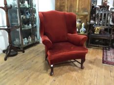 A George III style mahogany framed wing chair, late 19th century, with loose-cushioned seat,