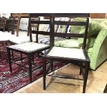 A pair of Arts & Crafts ebonised chairs, c. 1900, each ladder back above a formerly caned seat,