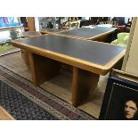 A 1940s oak writing table by Abbess, the rectangular top with tooled leather inset, raised on