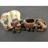 A carved soapstone elephant with painted decoration together with a soapstone brush wash and