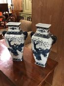 A pair of Decorator 20thc Chinese blue and white square tapered vases, with twin handles to side (2)