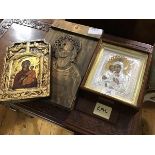 A group of three Russian icons, a metal framed icon in silver and gold coloured metals, a gold