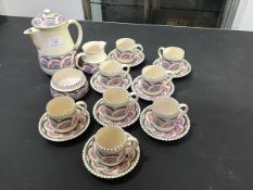 A Honiton coffee set consisting of coffee pot, jug, cream and eight cups and saucers
