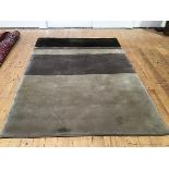 An Indian hand knotted wool rug (240cm x 170cm)