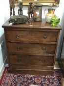 A small 19th century mahogany chest of drawers, the rectangular top above three drawers, raised on a