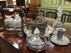 A mixed lot of a wooden tantalus with metal mounts, two decanters (one a/f), together with