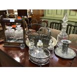 A mixed lot of a wooden tantalus with metal mounts, two decanters (one a/f), together with