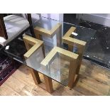 A modern glass and oak framed coffee table, the geometric base supporting a glass top (49.5 x 60 x