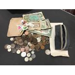 A collection of coins, stamps and banknotes including American and British silver and copper