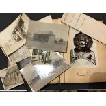 A photograph album containing images from Africa including Masai natives, buildings etc., attributed