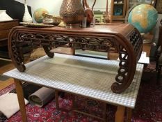 A Chinese burr-wood low table, the recessed panel top above a pierced frieze and inward scrolling