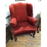 A George III style mahogany framed wing chair, late 19th century, with loose-cushioned seat,