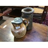 A Doulton style stoneware jug with pewter lid, decorated with tavern scenes and hunting dogs (h.