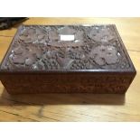 A carved hardwood box (30cm x 20cm x h. 8cm)