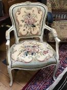 A pair of mid-20th century French salon chairs in the rococo taste, with painted frames and gros-