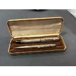 A silver fountain pen together with a silver pencil, with engine turned decoration, manufacture mark