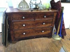 A 19th century mahogany chest of two short and two long drawers, with later glass handles,