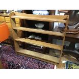 A modern oak Arts and Crafts style open bookcase, with four adjustable shelves (two adjustable),