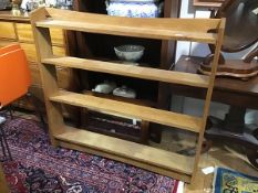 A modern oak Arts and Crafts style open bookcase, with four adjustable shelves (two adjustable),