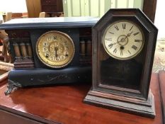 An ebonised wooden mantle clock with rectangular top, with central dial with brass and paper dial,