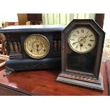 An ebonised wooden mantle clock with rectangular top, with central dial with brass and paper dial,