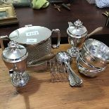 A mixed lot of silver plate including a twin handled cut glass biscuit barrel, two hot chocolate