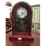 A rare American wooden dome top mantle clock with with unusual red painted case, the white painted