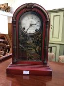 A rare American wooden dome top mantle clock with with unusual red painted case, the white painted