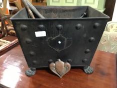 A rectangular tapered steel coal bin with twin handles and cast claw feet together with tools, h28cm